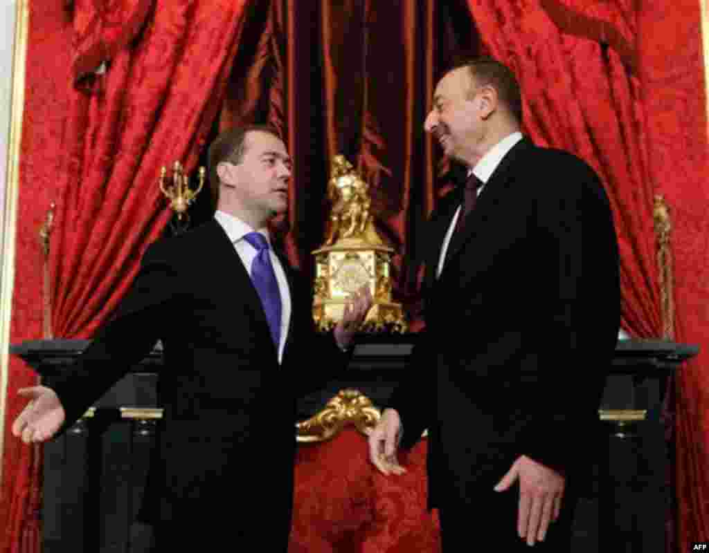 Russian President Dmitry Medvedev, left, greets Azerbaijani President Ilham Aliyev before a summit of the Collective Security Treaty Organization in the Kremlin in Moscow, Tuesday, Dec. 20, 2011. (AP Photo/RIA Novosti, Dmitry Astakhov, Presidential Press