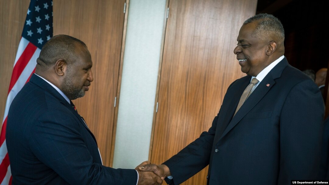 Secretary of Defense Lloyd J. Austin III greets Papua New Guinea Prime Minister James Marape in Port Moresby, Papua New Guinea, July 27, 2023. 