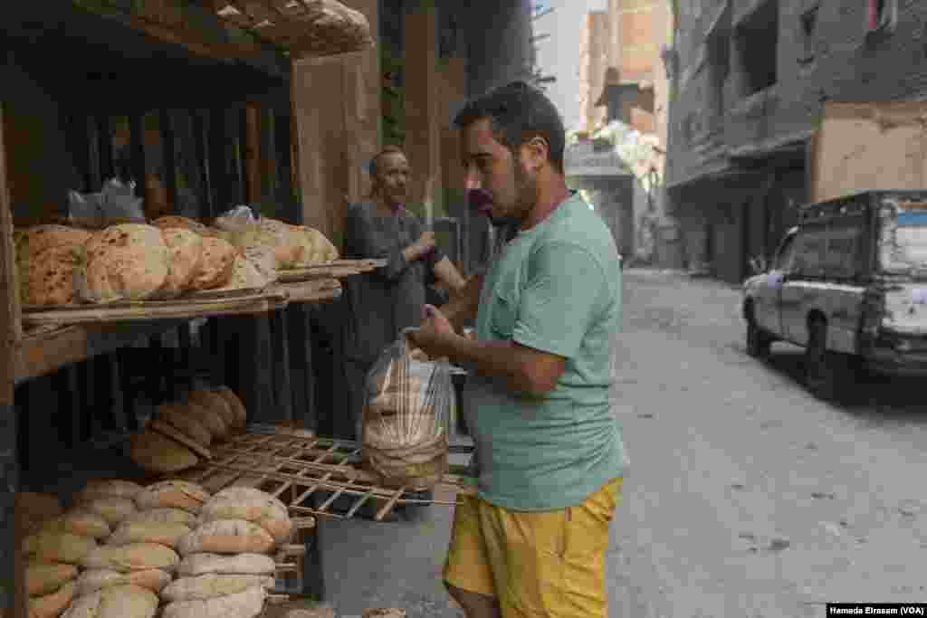 Mousa, a baker of subsidized bread, says, “My customers are upset about the rising cost of bread and other essentials — vegetables, meat, electricity and transportation. Sometimes they need to pay us later for their loaves.” Cairo, Egypt, June 24, 2024. (Hamada Elrasam/VOA)