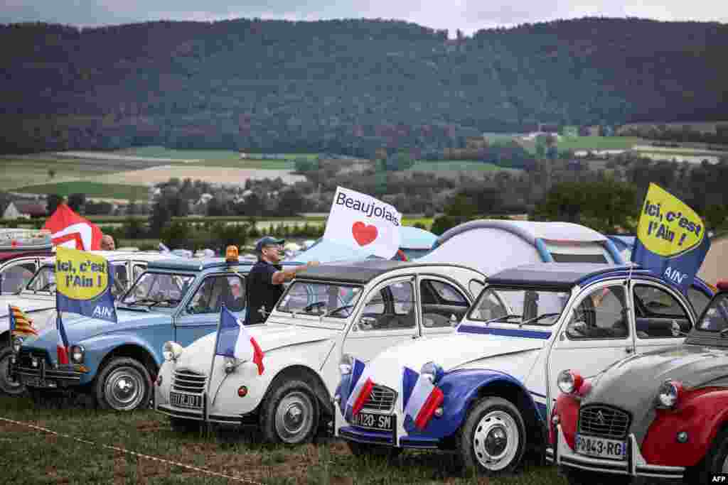 Cars are lined up in a field during the 24th World meeting of Citroen 2CV friends near Delemont, northern Switzerland, July 26, 2023.