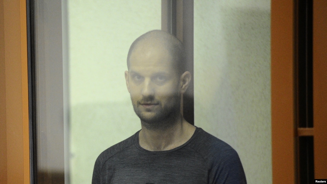 Wall Street Journal reporter Evan Gershkovich stands inside an enclosure for defendants as he attends a court hearing in Yekaterinburg, Russia, July 19, 2024. 