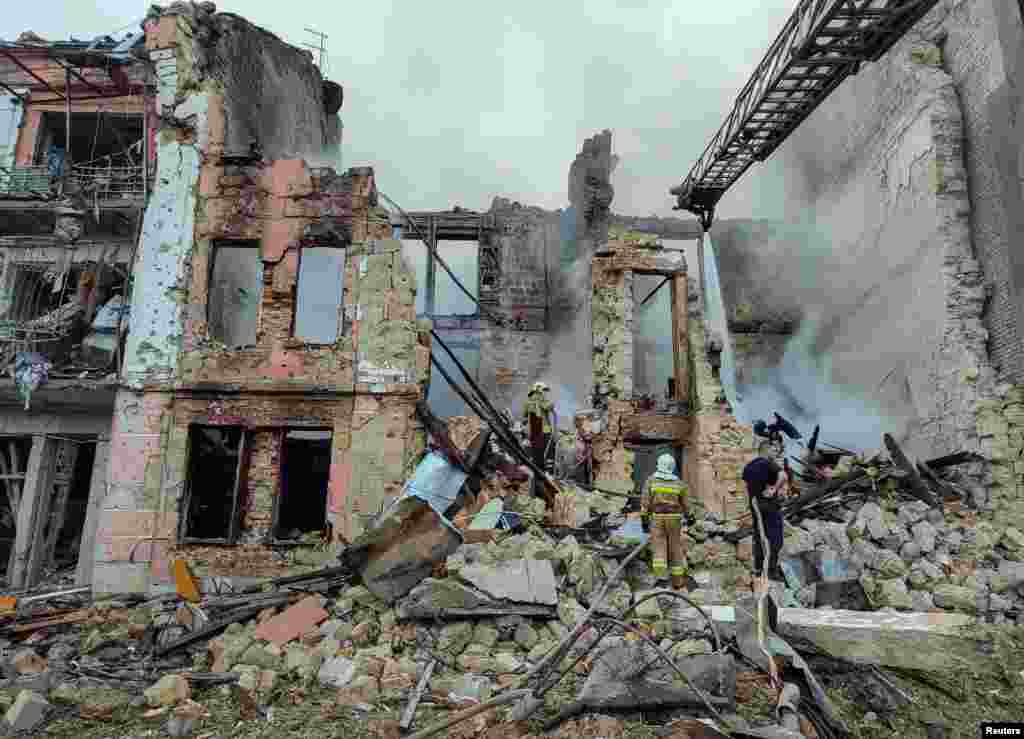Rescuers work at the site of a residential building heavily damaged by a Russian missile attack in Mykolaiv, Ukraine.