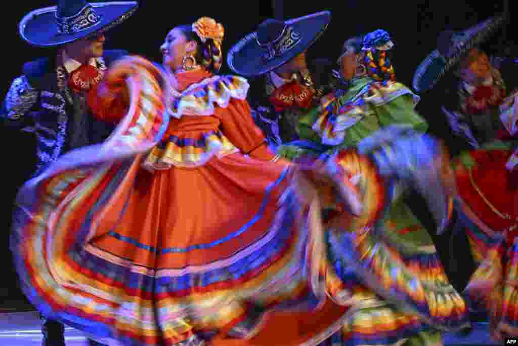 Dancers from Mexico perform during the opening of the 1st World Meeting of Popular Cultures, at the Municipal Theatre in Cali, Colombia, April 24, 2023. 