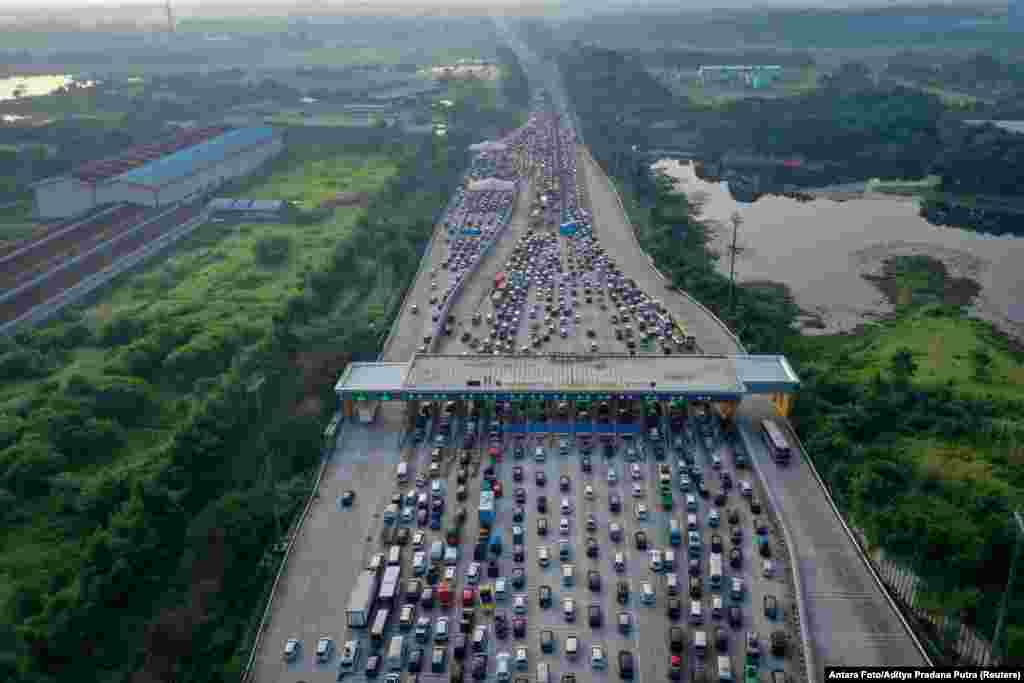 An aerial photo of a traffic jam at a toll booth of a highway, as Indonesian Muslims go back to their hometown to celebrate Eid al-Fitr, known locally as 'Mudik' in Karawang, Indonesia.