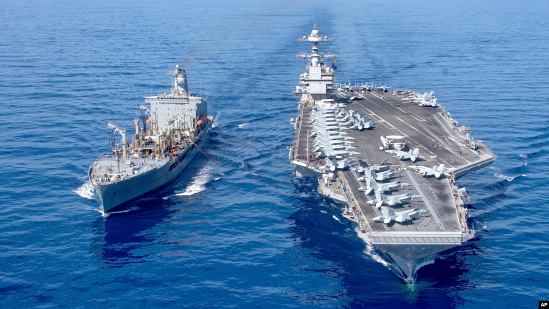 FILE - USS Gerald R. Ford aircraft carrier refuels from the underway replenishment oiler USNS Laramie in the eastern Mediterranean Sea, Oct. 11, 2023. (U.S. Navy photo via AP)