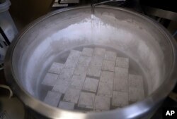 FILE - In this Oct. 2, 2018 photo, containers holding frozen embryos and sperm are stored in liquid nitrogen at a fertility clinic in Fort Myers, Florida. The Alabama Supreme Court has ruled that frozen embryos can be considered children under state law.