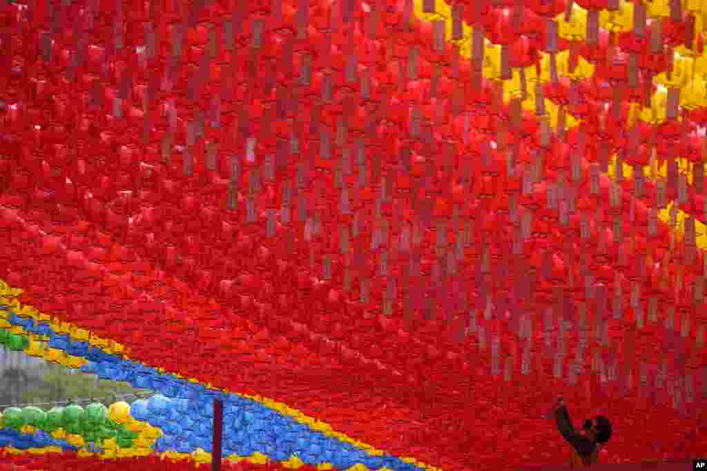 A man attaches the name tag of a worshiper in preparation for upcoming celebration of Buddha's birthday on May 27 at Jogye temple in Seoul, South Korea.