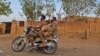 Sudanese army soldiers ride a motorcycle in Khartoum, on June 26, 2023. 
