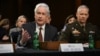 FILE - CIA Director William Burns, left, testifies during a Senate Intelligence Committee hearing on worldwide threats in Washington on March 8, 2023. Burns traveled to Qatar on Nov. 28, 2023, for talks on the truce between Israel and Hamas. 