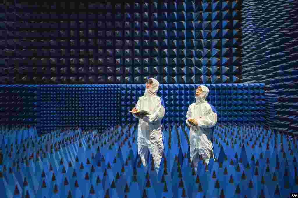 Technicians are seen testing a new material at a company in Ningbo, in China's eastern Zhejiang province.