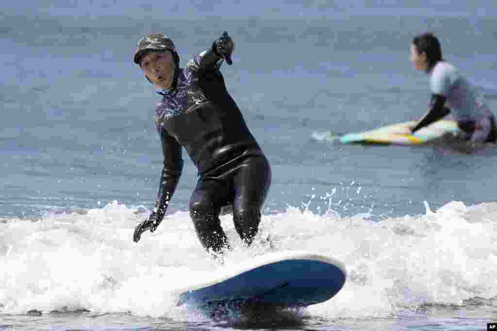 Seiichi Sano, an 89-year-old Japanese man, rides a wave at Katase Nishihama Beach, in Fujisawa, south of Tokyo. Sano, who turns 90 later this year, has been recognized by the Guinness World Records as the oldest male to surf.