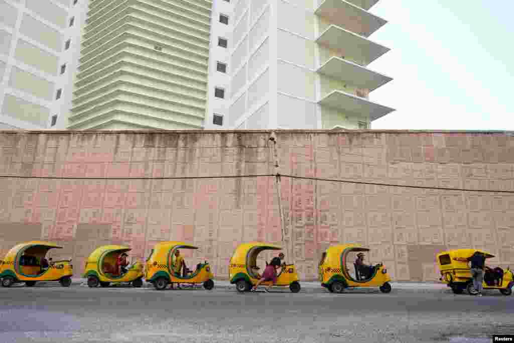 Taxi drivers wait in line to put fuel at a petrol station in Havana, Cuba, April 25, 2023.