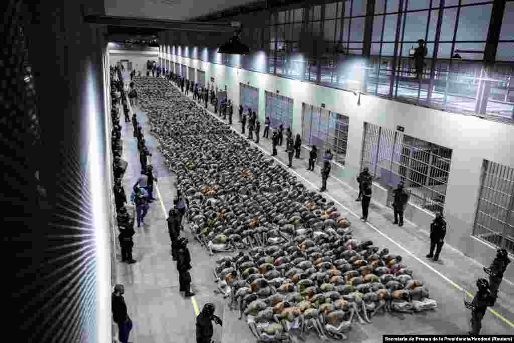 Two thousand gang members wait to be taken to their cells after they were transferred to the Terrorism Confinement Center, according to El Salvador's President Nayib Bukele, in Tecoluca, March 15, 2023. 