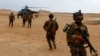 Iraqi Special Forces members board a helicopter during the "Solid Will" military operation against Islamic State militants in the desert of Anbar, Iraq, April 23, 2022. 
