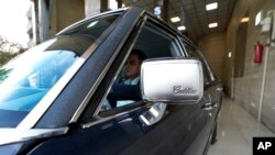 Khosro Dahaghin drives out his restored Cadillac Seville at his dealership store in Roudehen, some 30 miles (45 kilometers) east of downtown Tehran, Iran, June 7, 2023.
