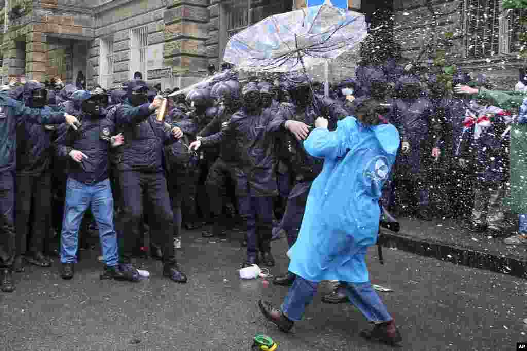 Police disperse demonstrators trying to block the Parliament building during an opposition protest against "the Russian law" in the center of Tbilisi, Georgia. Daily protests are continuing against a proposed bill that critics say would stifle media freedom and obstruct the country's bid to join the European Union.