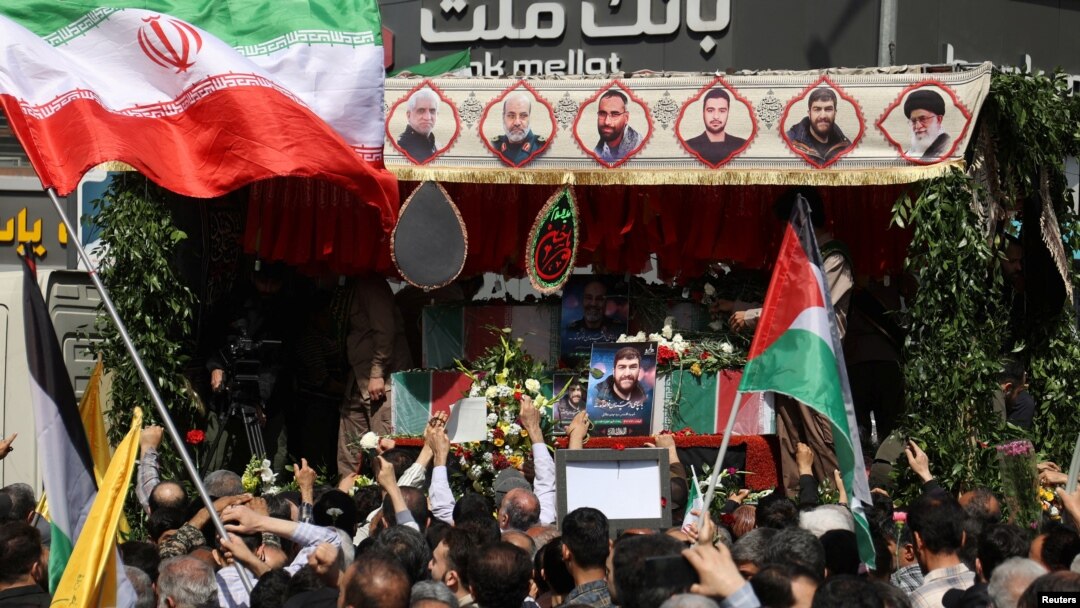 People in Tehran, Iran, gather for the funeral of members of the Islamic Revolutionary Guard Corps killed on April 1, 2024, in a suspected Israeli airstrike at the Iranian embassy in Damascus, Syria, April 5, 2024. (West Asia News Agency via Reuters)