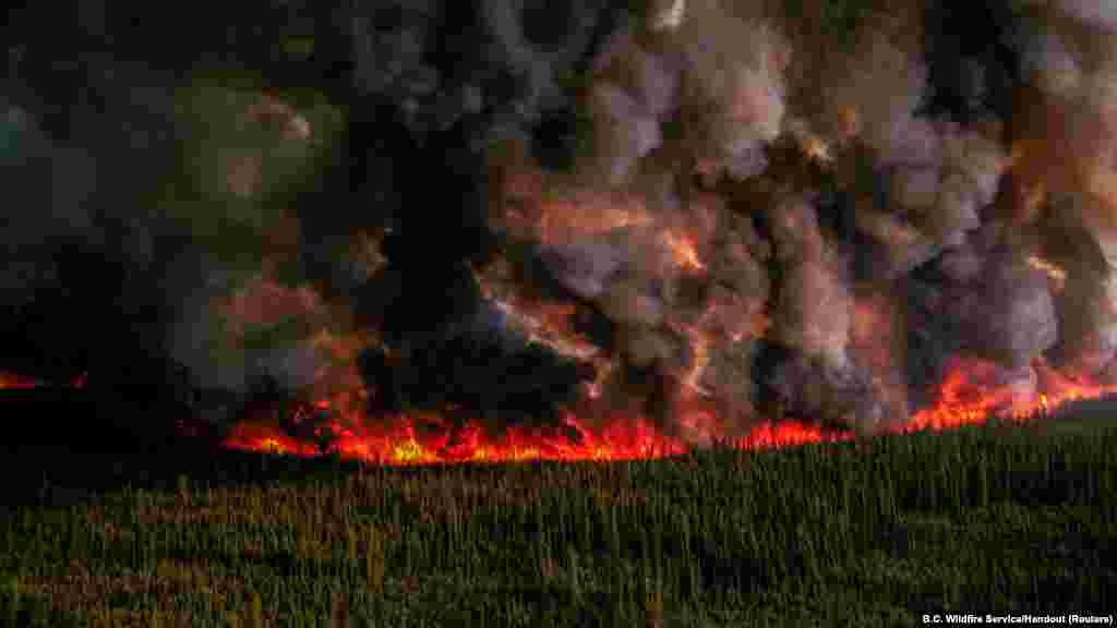 Smoke billows from a planned ignition by firefighters tackling the Donnie Creek Complex wildfire south of Fort Nelson, British Columbia, Canada, June 3, 2023.