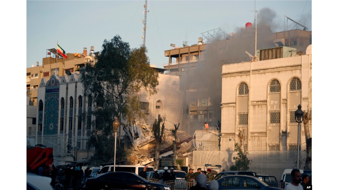Emergency services work at a destroyed building hit by an air strike in Damascus, Syria, April 1, 2024. The airstrike, widely attributed to Israel, destroyed the consular section of Iran's embassy in Damascus, killing 12 people.