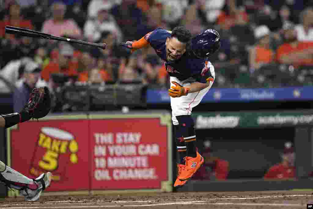 Houston Astros' Jose Altuve reacts after being hit by a pitch thrown by Washington Nationals starting pitcher Josiah Gray during the first inning of a baseball game, in Houston, Texas, June 14, 2023.