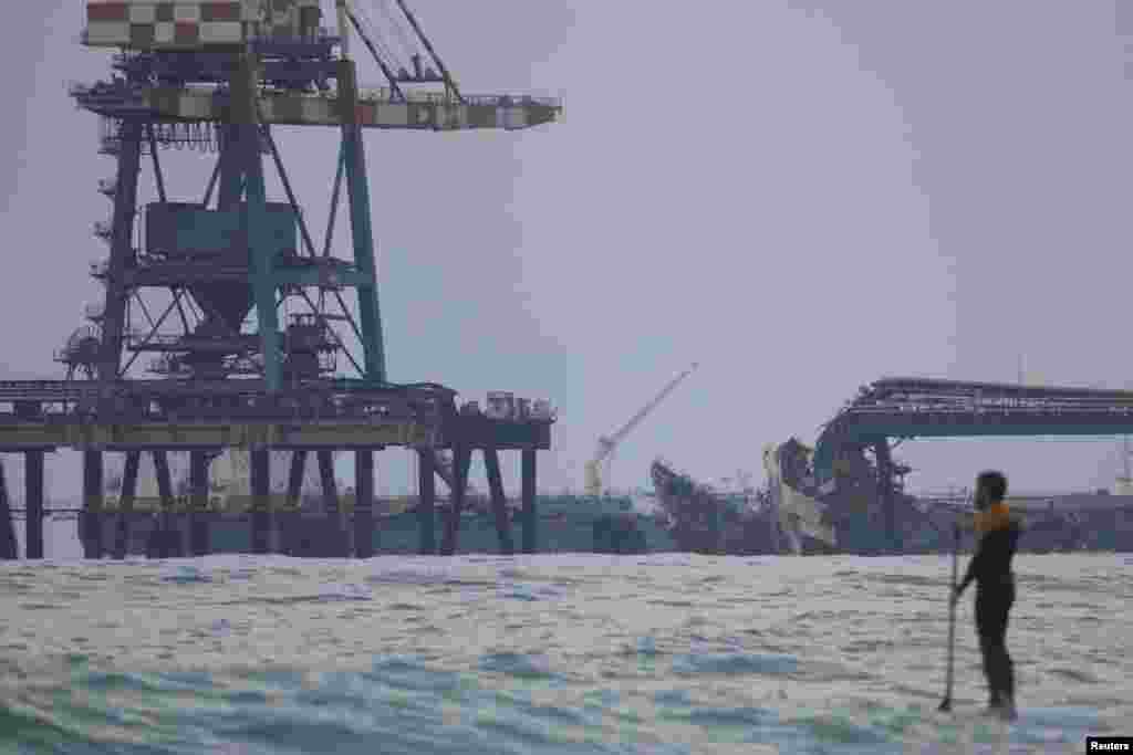 A view shows a crane that collapsed into the sea leaving one person injured and two others missing, according to Israeli police, near Ashkelon, March 14, 2023.