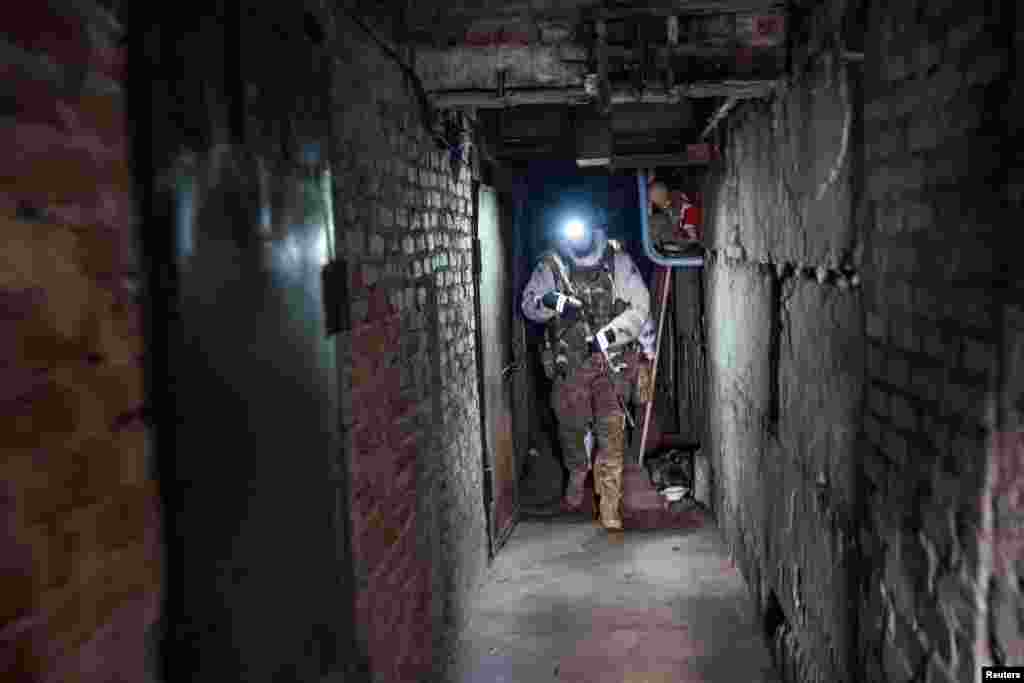 A Ukrainian serviceman of the 80th Independent Air Assault Brigade walks through his base, as Russia's attack on Ukraine continues, near the frontline town of Bakhmut, Donetsk region, Ukraine.