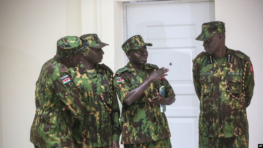 Members of a U.N.-backed force led by Kenya stand at police headquarters ahead of a press conference in Port-au-Prince, Haiti, July 8, 2024.