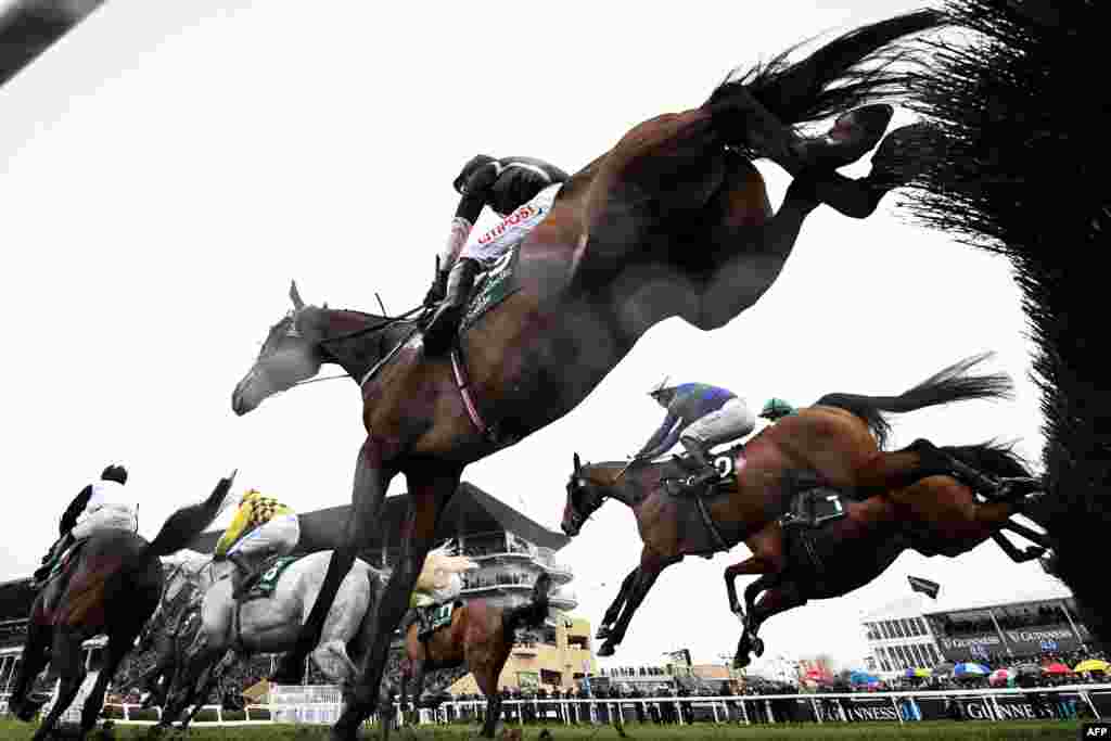 Competitors take part in The Brown Advisory Novices&#39; Steeple on the second day of the Cheltenham Festival at Cheltenham Racecourse, in Cheltenham, England.