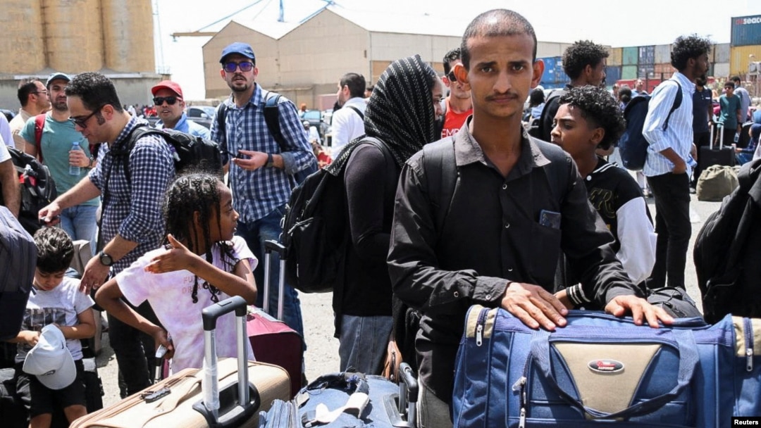 European, Asian and African nationals fleeing from the fighting in Sudan prepare to board a ship to Saudi Arabia, at Port Sudan, April 28, 2023.