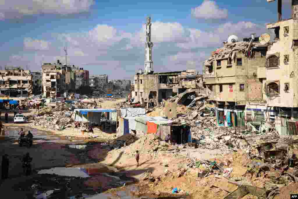 Tents are set up by displaced Palestinians amid the devastation in Khan Yunis in the southern Gaza Strip.
