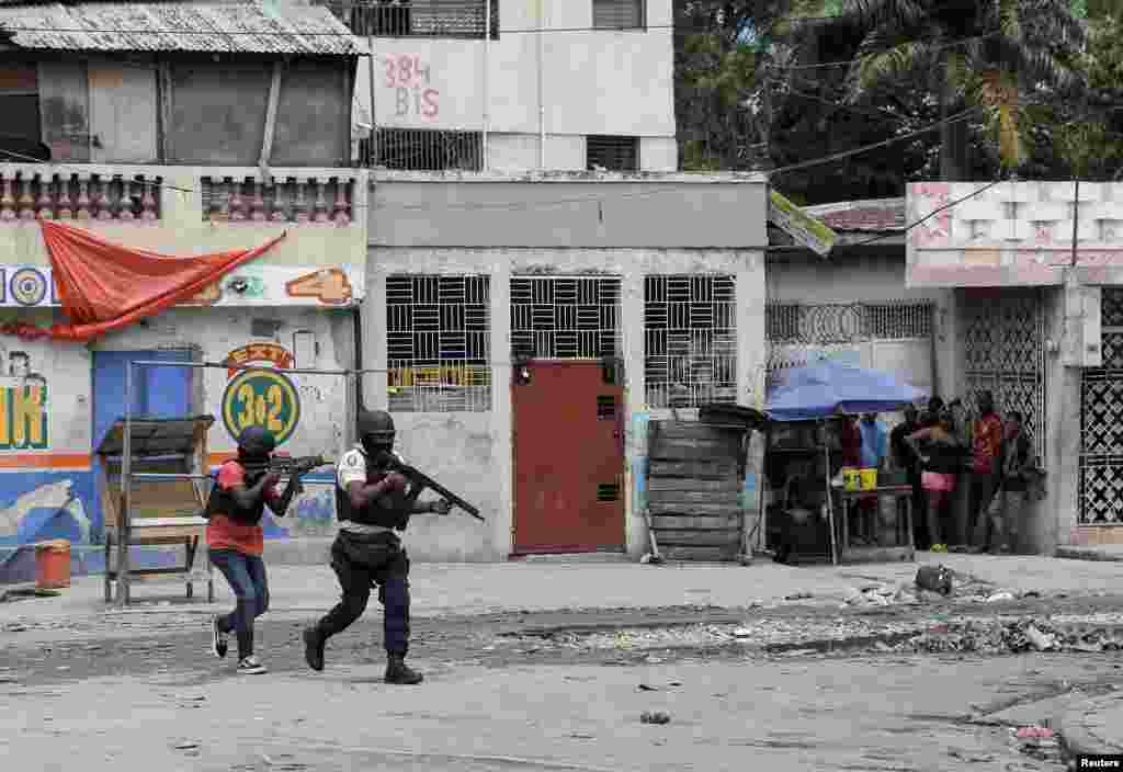 Police patrol the streets after gang members tried to attack a police station in Port-au-Prince, Haiti, April 25, 2023.
