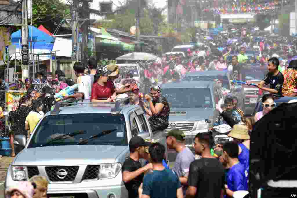 Revelers take part in water fights on the first day of Songkran, or Thai New Year, in Thailand's southern province of Narathiwat, April 13, 2024.