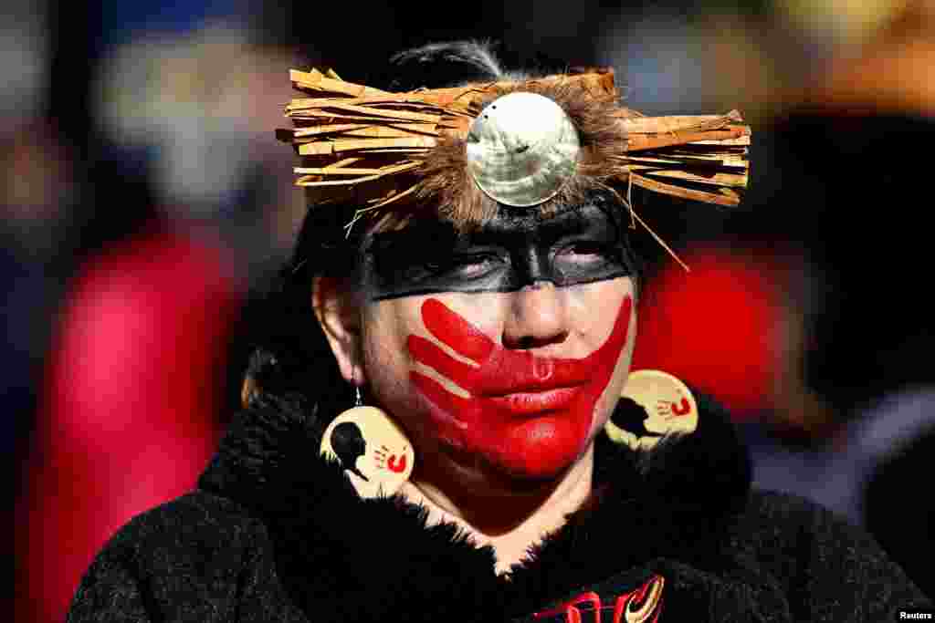 People march through the Downtown Eastside for the 32nd annual Women's Memorial March, honoring missing and murdered Indigenous women in Vancouver, British Columbia, Canada, Feb. 14, 2023.