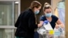 Nurses care for newborns at a hospital in Burlington, Vermont, April 28, 2023. Research found that babies born to opioid users had shorter hospital stays when their care emphasized parent involvement. (Ryan Mercer/University of Vermont Health Network via AP)