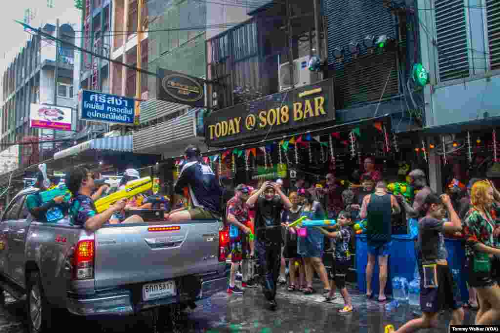 People celebrate Songkran on Soi 11, a popular street in Bangkok for nightlife, Bangkok, April 13, 2024.