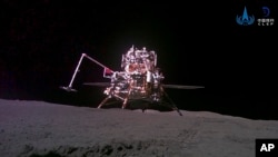 This China National Space Administration (CNSA) handout image released by Xinhua News Agency, shows the lander-ascender combination of Chang'e-6 probe taken by a mini rover after it landed on the moon surface, Tuesday, June 4, 2024. (CNSA/Xinhua via AP)