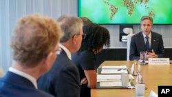 Secretary of State Antony Blinken, right, participates in a roundtable discussion on food security, Aug. 3, 2023, at the Rockefeller Foundation in New York. 