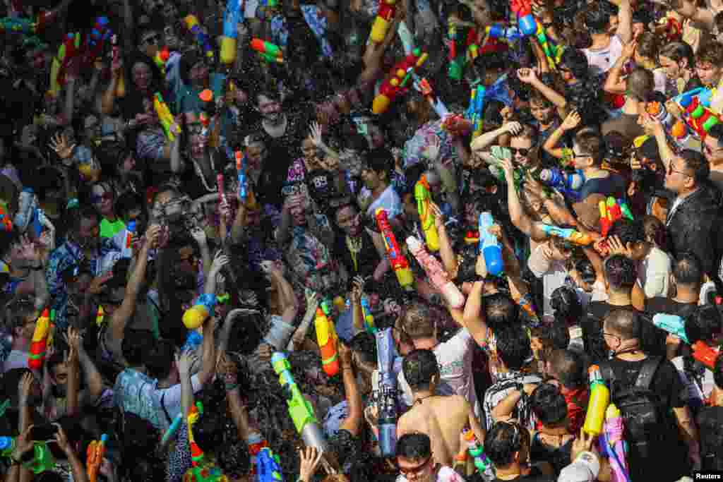 Locals and tourists play with water as they celebrate the Songkran holiday which marks the Thai New Year in Bangkok, Thailand, April 13, 2024.