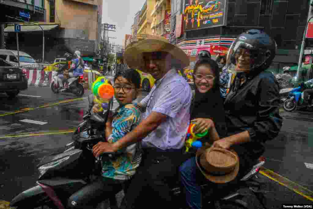 People enjoy the Songkran festival in Bangkok, April 13, 2024.