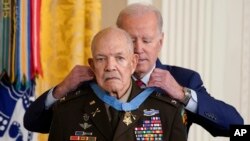 President Joe Biden awards the Medal of Honor to retired Army Col. Paris Davis for his heroism during the Vietnam War, in the East Room of the White House, March 3, 2023, in Washington.