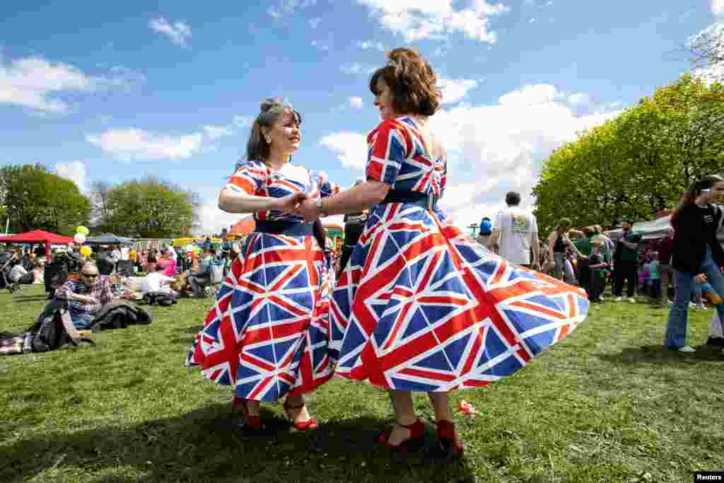 Laura Bridgewater and Joan Hoctor from the band "Gentlemen Prefer Blondes" entertain the crowds at the 10th Calon Hearts, Cardiff Carnival, Wales, Britain, May 1, 2023.