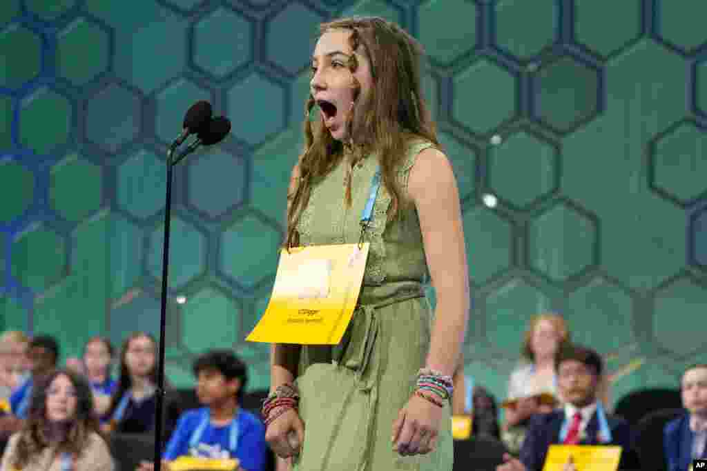 Elise Cournoyer, 14, from Richmond, Vermont., competes during the Scripps National Spelling Bee in Oxon Hill, Maryland.