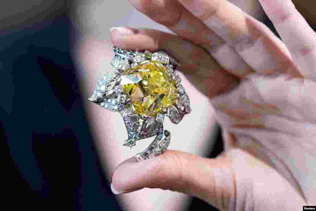 The Allnatt, a 101.29-carat yellow diamond, mounted as a brooch by Cartier, is displayed ahead of auction, during a Sotheby's media preview in Geneva, Switzerland.