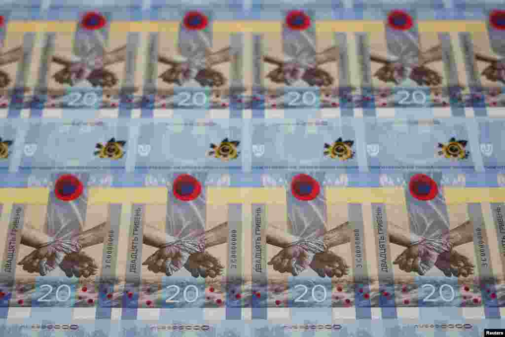 Banknotes dedicated to the first anniversary of Russia's invasion on Ukraine are seen during a presentation at the Ukrainian National Bank in Kyiv, Ukraine.