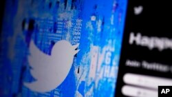 The Twitter splash page is seen on a digital device on April 25, 2022, in San Diego. (AP Photo/Gregory Bull, File)