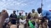 FILE - Mohamed Toumba, one of the soldiers who ousted Nigerian President Mohamed Bazoum, addresses supporters of Niger's ruling junta in Niamey, Niger, Aug. 6, 2023.