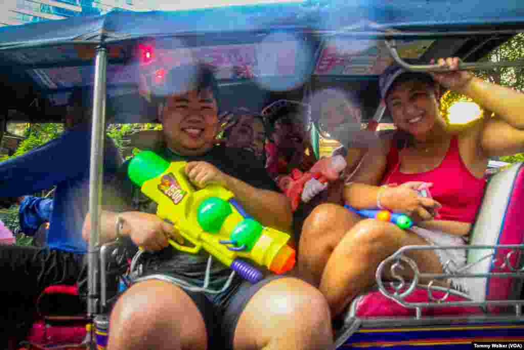 Thais celebrate the Songkran festival in Bangkok, Thailand, April 13, 2024.