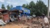 Residents salvage their household items after their homes were swamped following rains that triggered flooding and landslides in Rubavu district, Western province, Rwanda, May 3, 2023. 