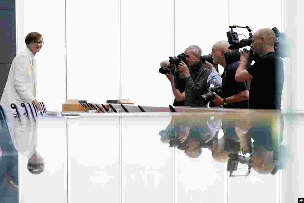 Germany's Science Minister Bettina Stark-Watzinger, left, arrives for a news conference to present the government's new strategy for supporting research into nuclear fusion, a technology some hope will some day provide almost unlimited, clean energy, in Berlin, Germany.