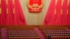 An official prepares prior to the second plenary session meeting of the National People's Congress (NPC) in the Great Hall of the People in Beijing, March 8, 2024.
